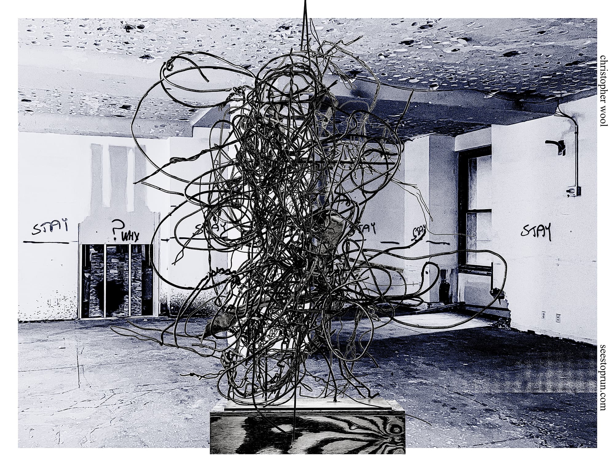 A two-tone image of a horizontally oriented exhibition poster. A black and white wire sculpture sits on a plywood pedestal in front of an interior corner space seemingly under construction. Spray painted on the wall are the words "stay" and "why?". The background has been digitally colored blue.